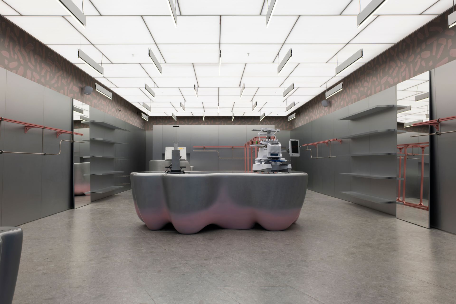 Explore the sleek, modern interior of a futuristic clothing store in Bursa, Turkey.